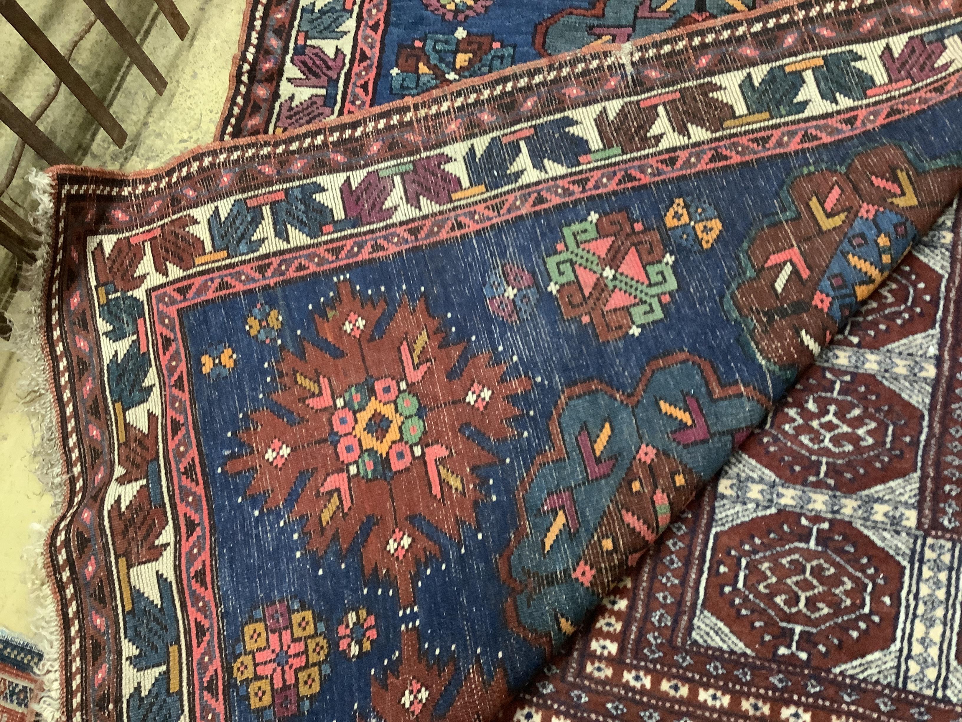 A Caucasian Seychour blue ground rug, 144 x 98cm